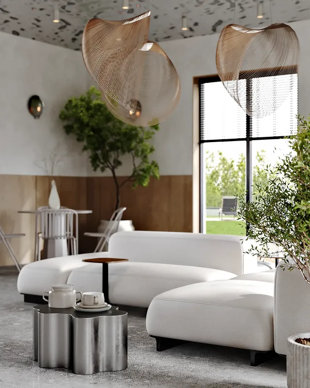 Close-up of a coffee table next to a plush sofa in the cafe lounge.