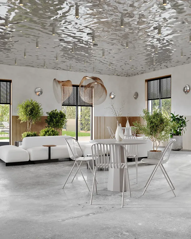 Cafe dining space featuring a window table for four and a separate sofa lounge.