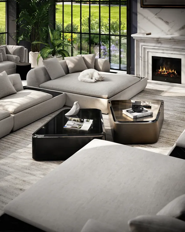 Overhead view of a dark classic sofa group, with a cozy cat sleeping on the ottoman.