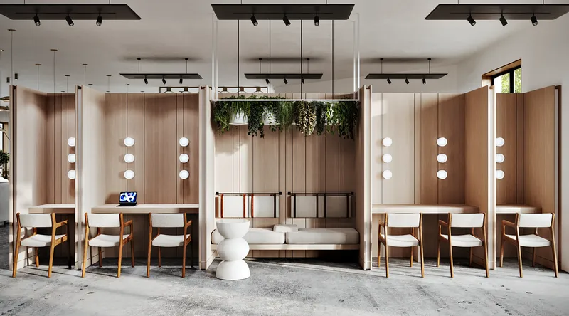 Frontal view of a flexible lobby space with workstations and a lounge area defined by wood partitions.