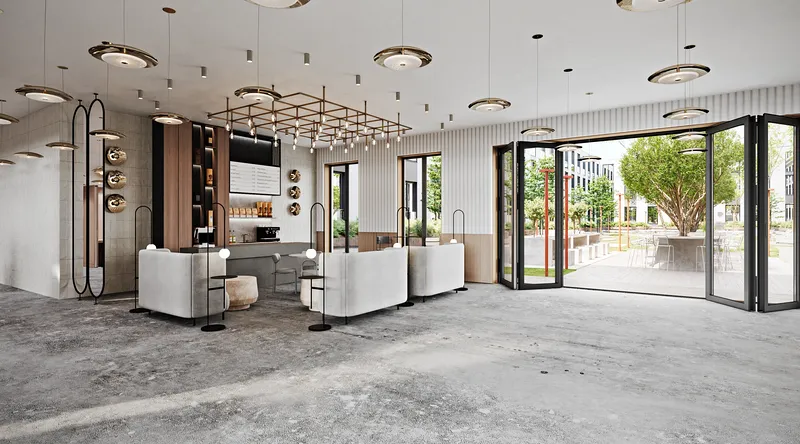 Corner view of the modern cafe, showing the sleek bar, high-back seating, and courtyard entrance.
