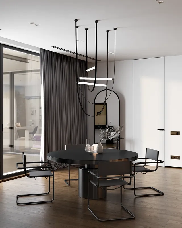 View of a modern dining table and chairs situated within the open-plan kitchen.