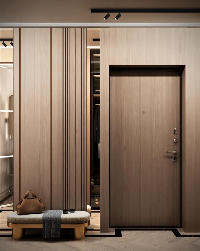 Apartment entrance area featuring a comfortable upholstered bench and a full-length mirror.