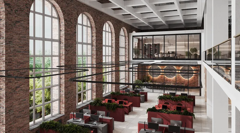 Aerial view of a modern open-plan office featuring partitioned desks and an executive suite.