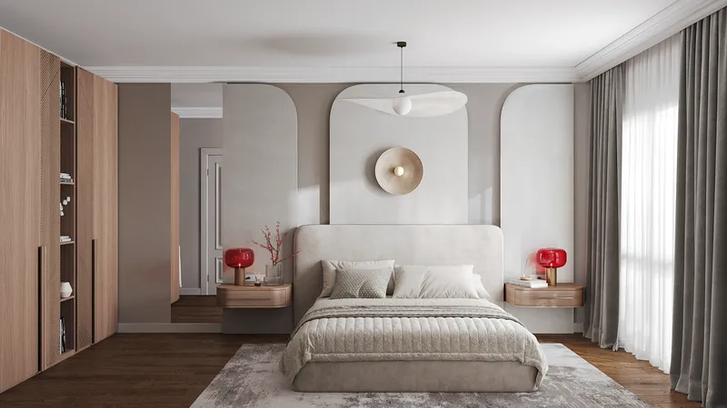 Front view of a bed with bedside tables, mirror, and wardrobe.