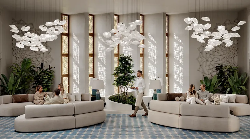 General view of a main lobby area with people waiting to check in.