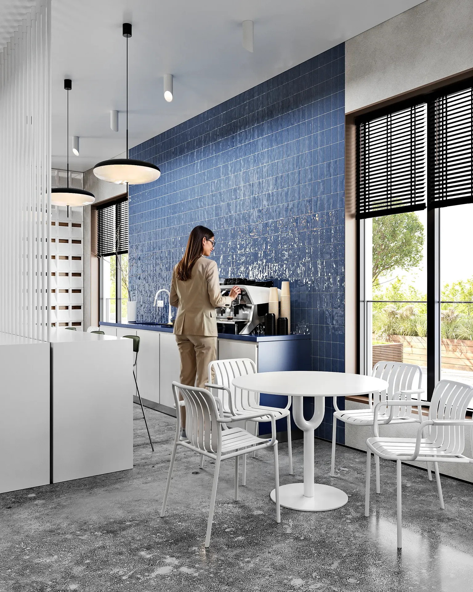 Modern office cafeteria with a woman preparing coffee at the beverage station.