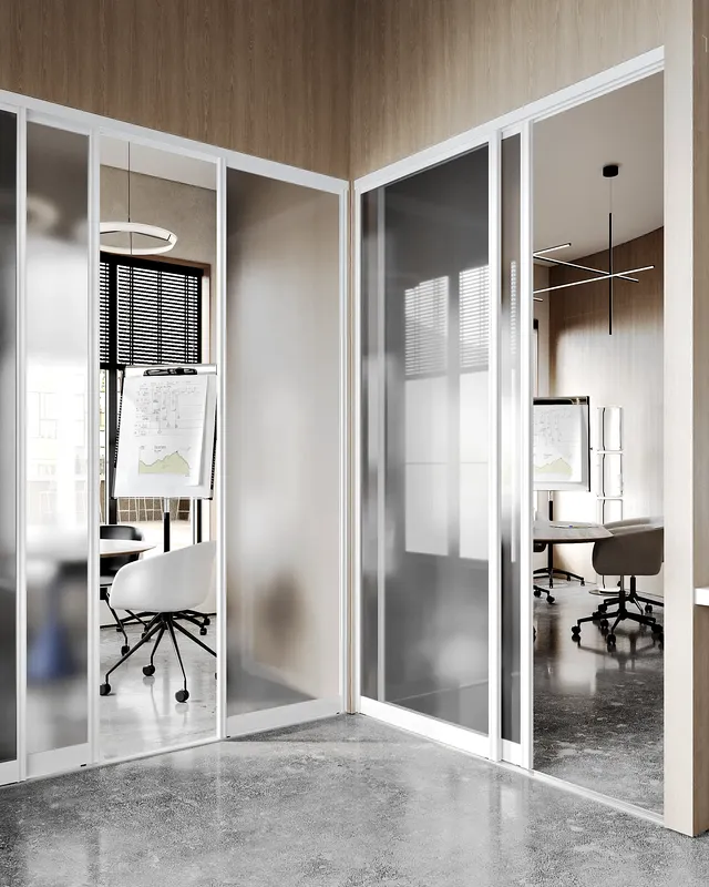 Hallway view showing the entrances to several modern, private meeting rooms.