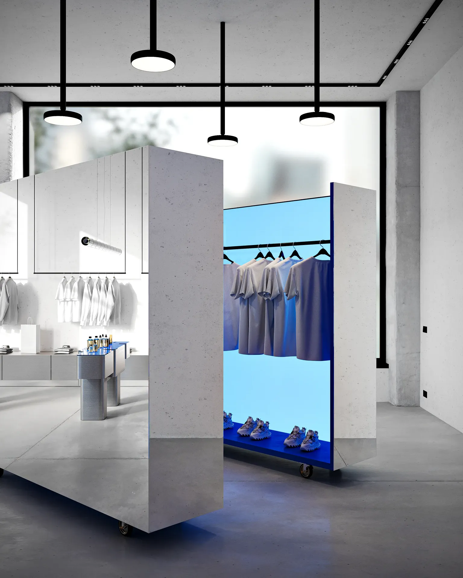 Minimalist retail shelving displaying a curated collection of clothing and footwear.