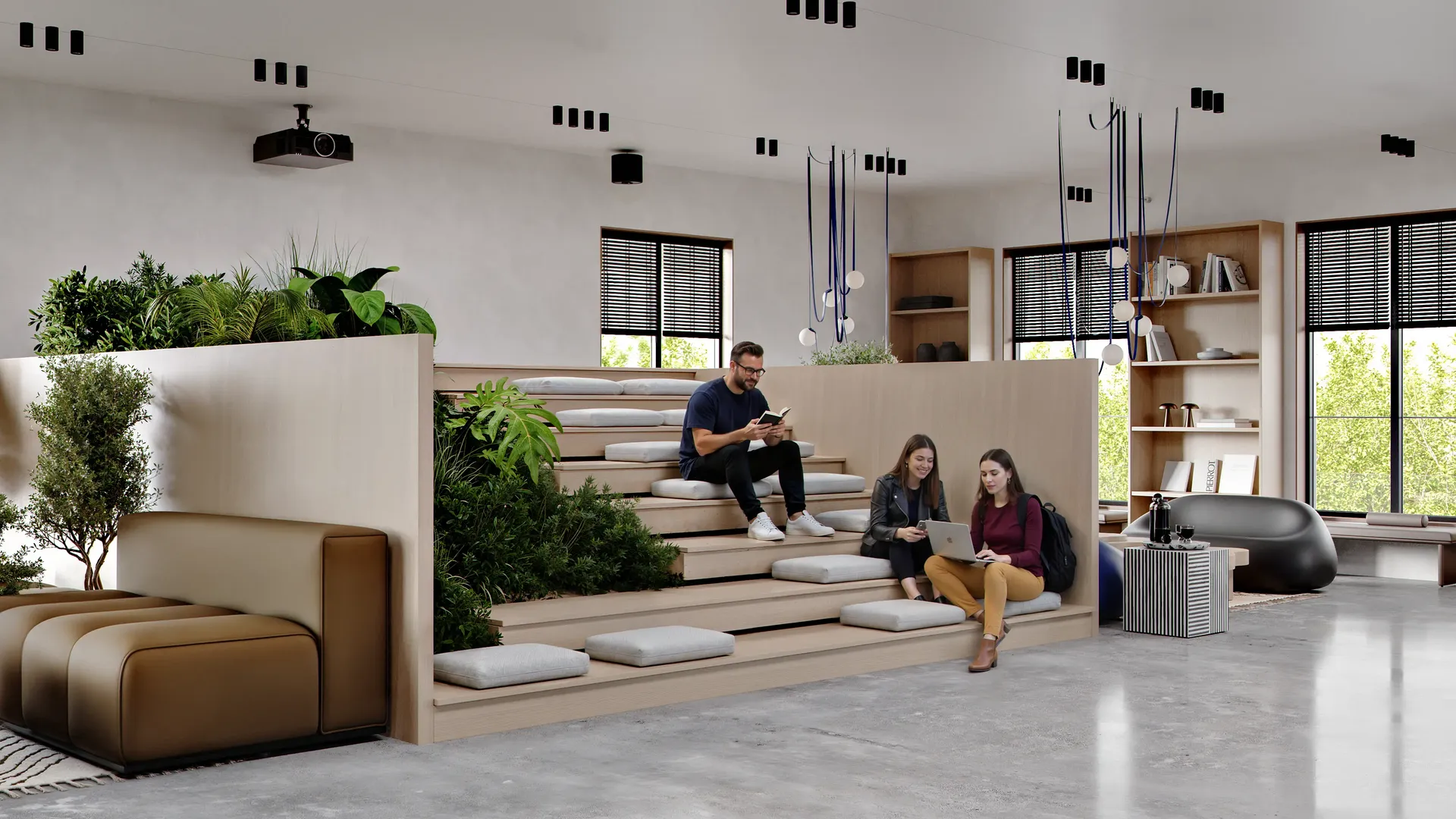 Students relaxing and watching a movie in a modern, communal screening room.