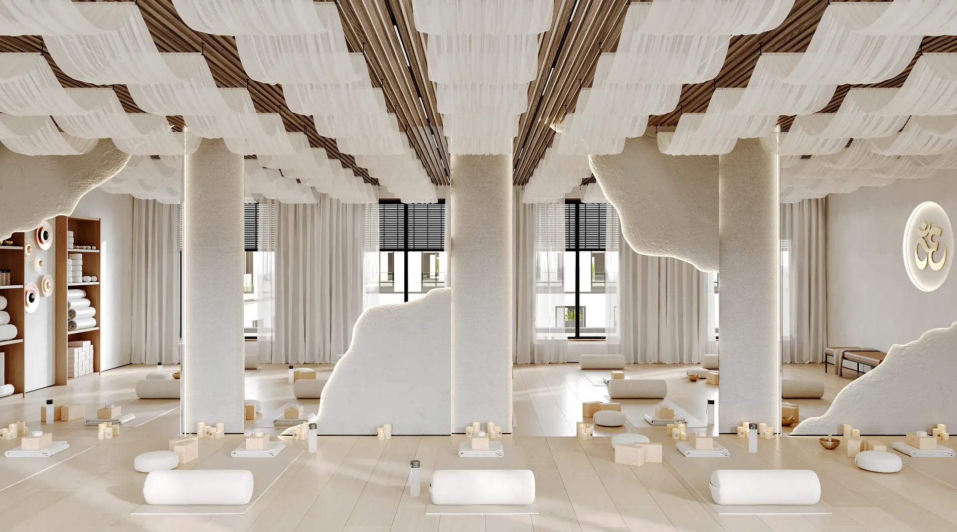 Bright yoga studio with yoga mats neatly arranged in front of a full mirrored wall.