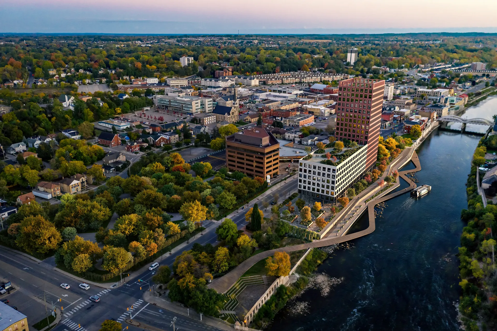 Aerial bird's-eye view of a modern residential neighborhood, showing rooftops and green spaces.