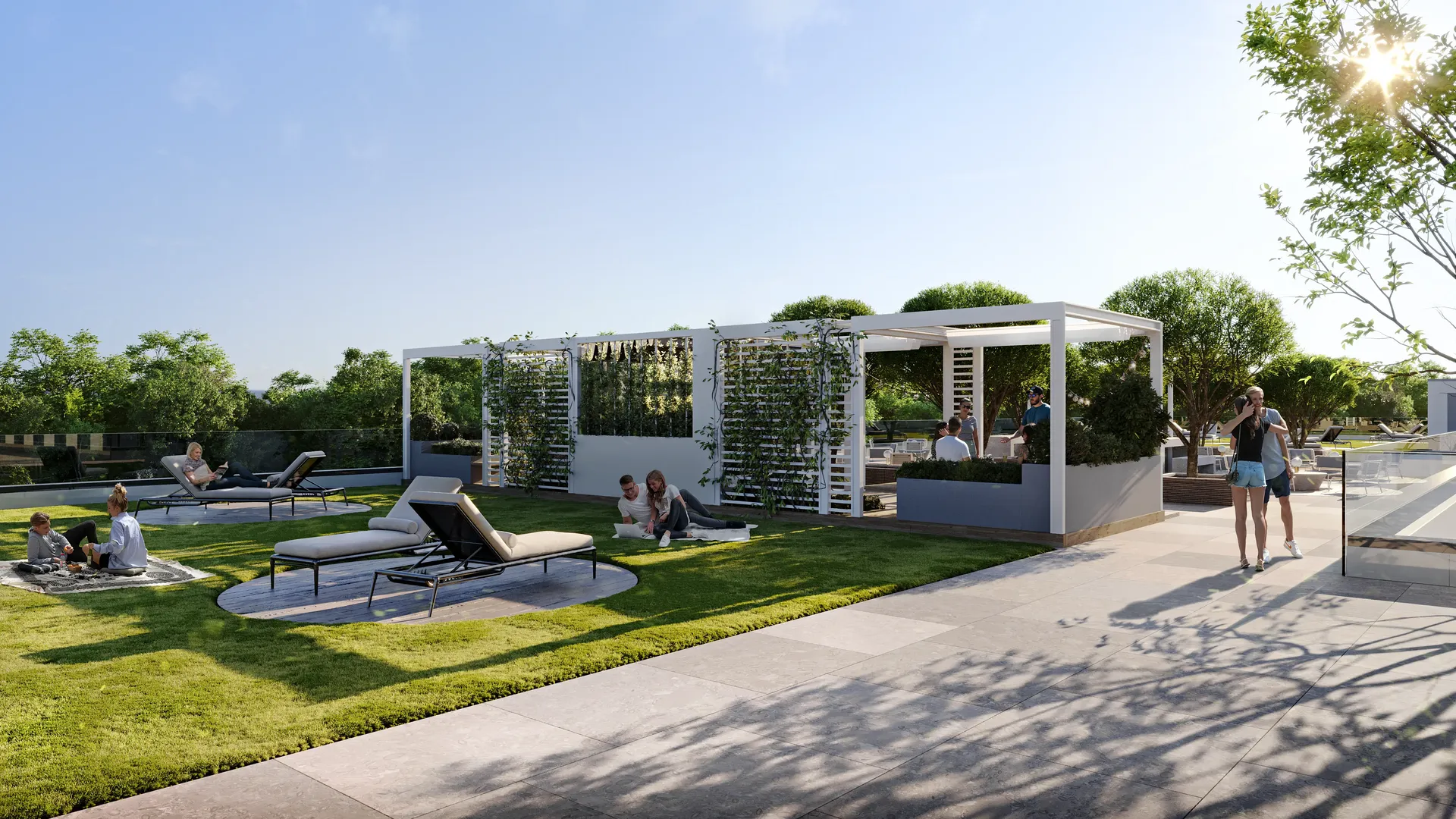 Sunlit relaxation area in a complex, featuring modern sun loungers, gazebos, and landscaped pathways.