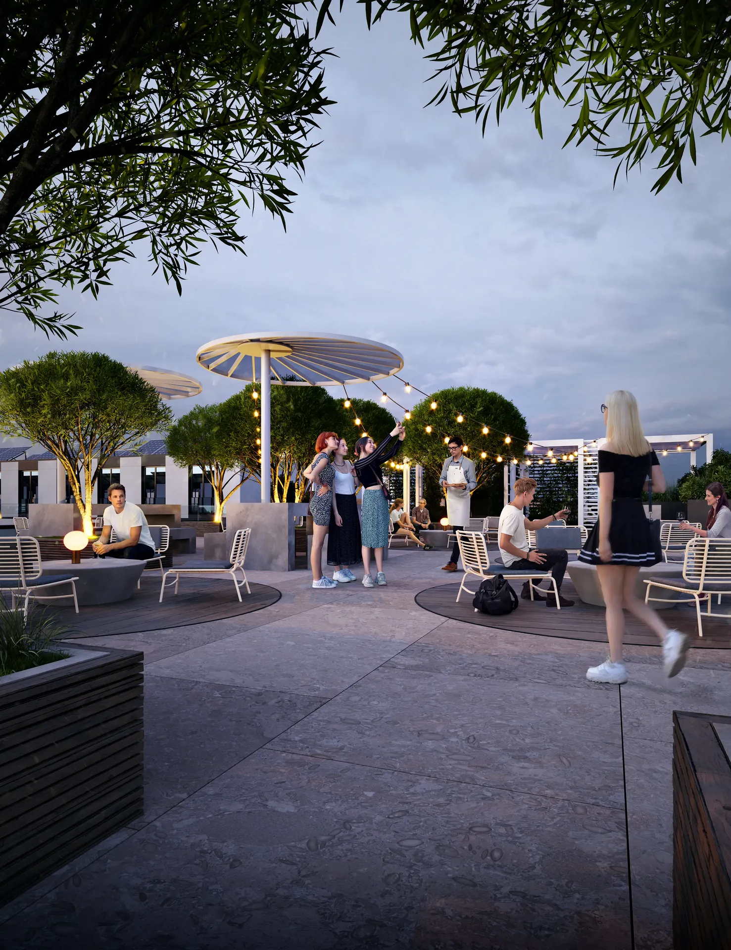 Lively evening atmosphere at an outdoor cafe, with people dining under glowing string lights and umbrellas.