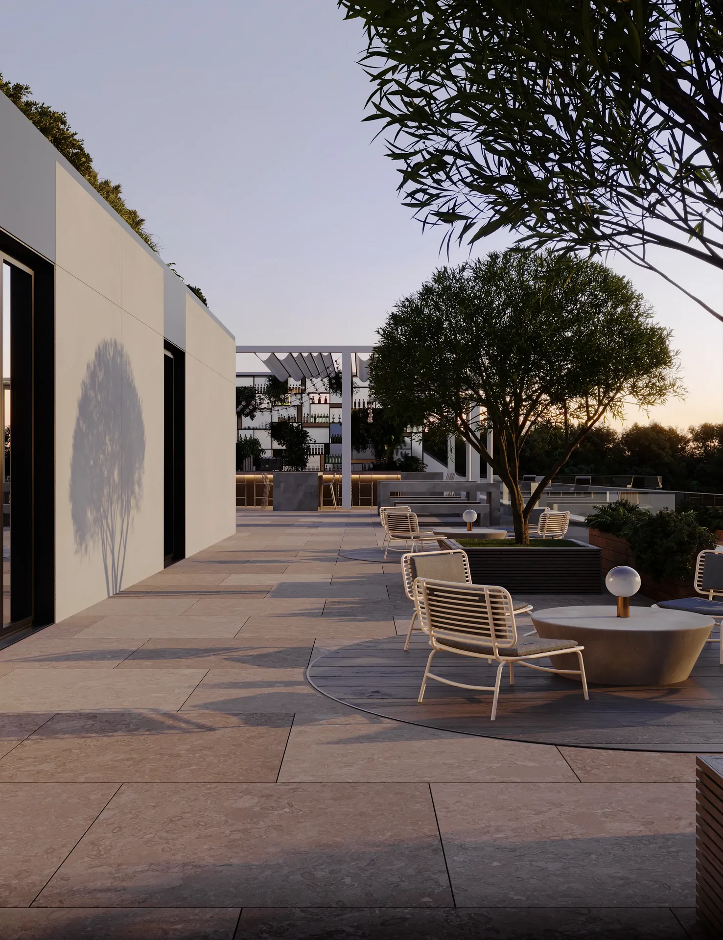 Serene outdoor cafe terrace at sunset, with tables and seating bathed in warm twilight.