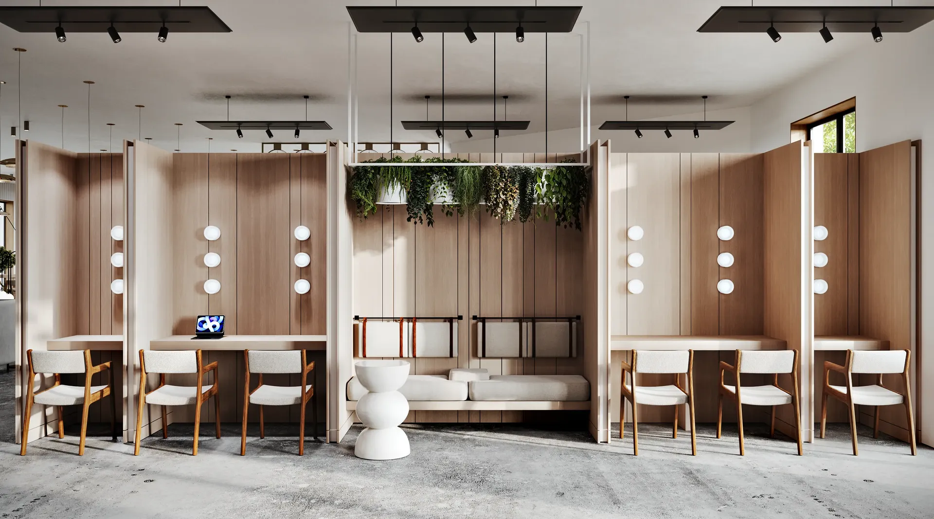 Frontal view of a flexible lobby space with workstations and a lounge area defined by wood partitions.