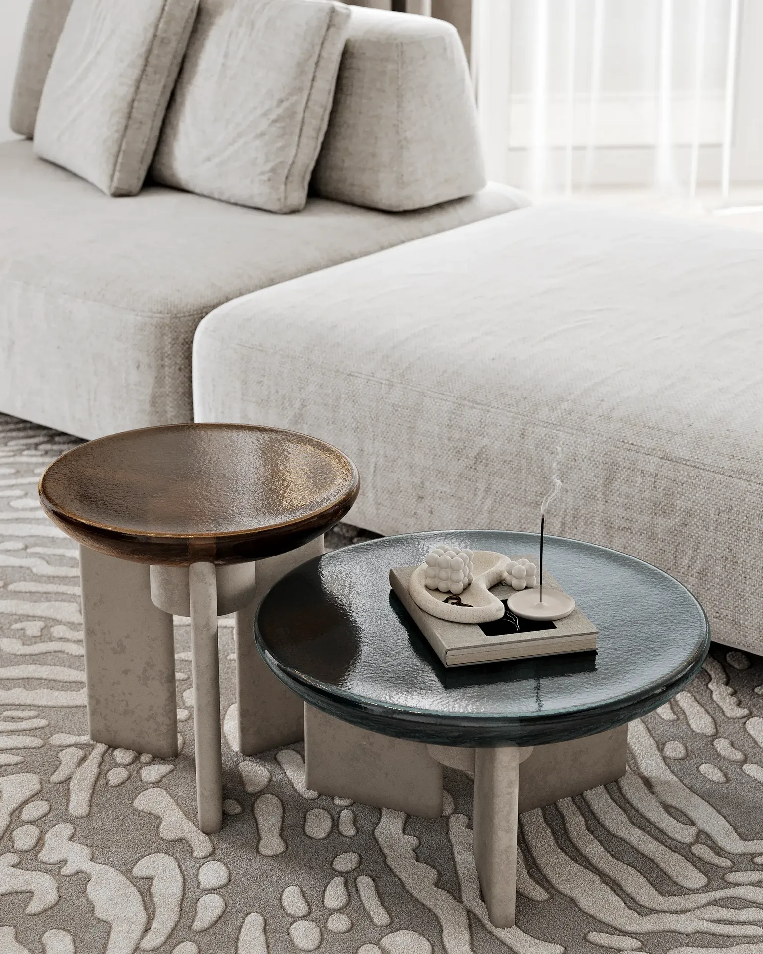 Detail shot of modern coffee tables with curated decorative items in a living room.