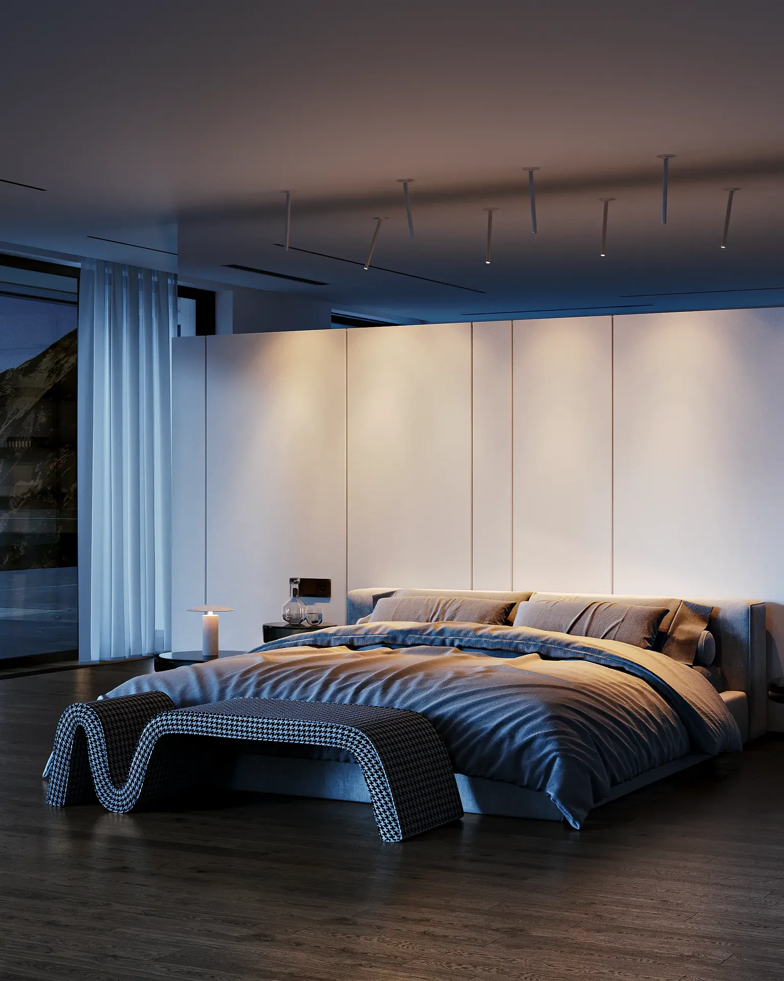 Atmospheric evening view of a modern bedroom, mixing cool natural light with warm interior lighting.