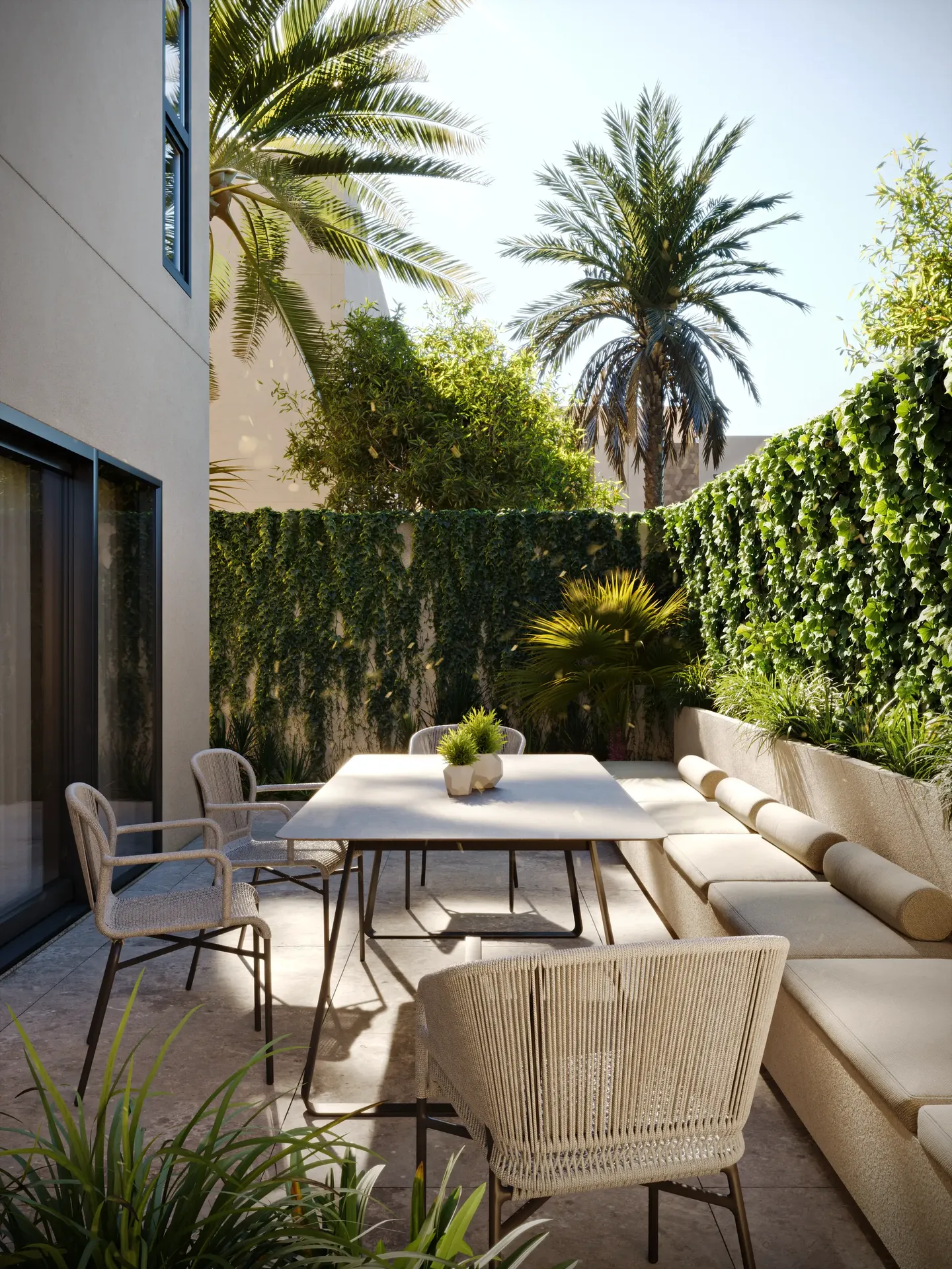 Outdoor terrace seating area with furniture and privacy hedge landscaping