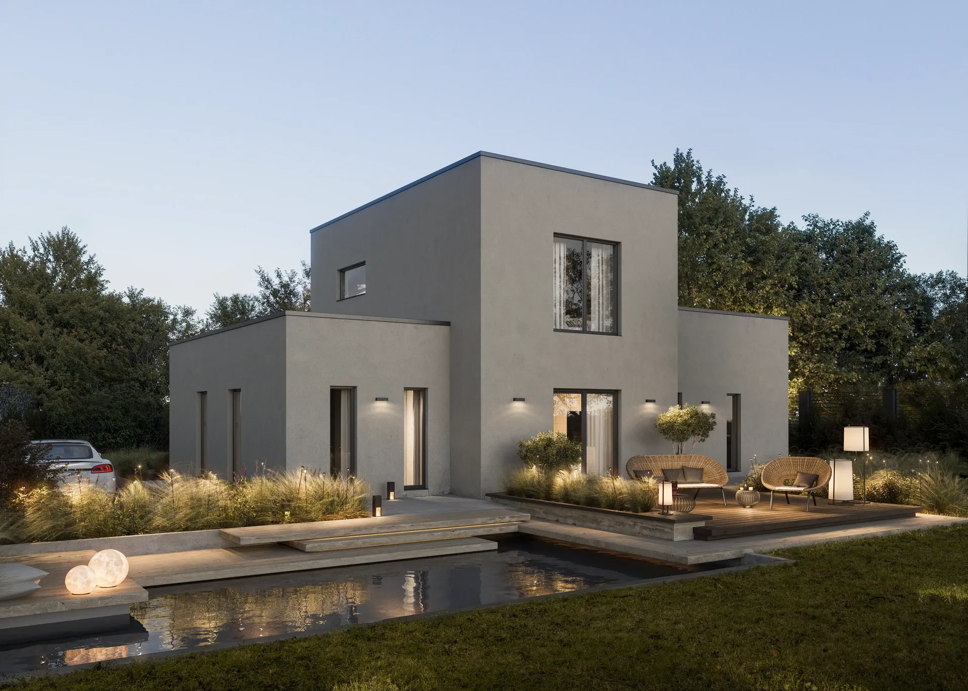 Evening view of a pool and terrace with atmospheric outdoor lighting.