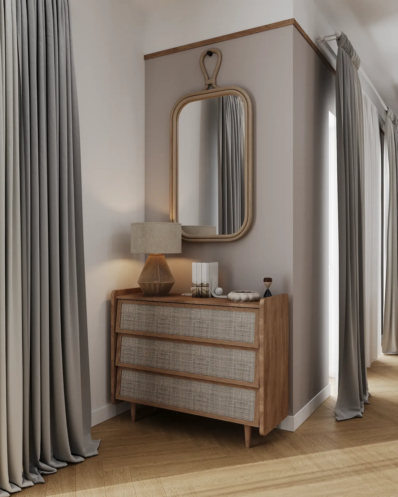 View of a chest of drawers with a mirror near the kitchen entrance.