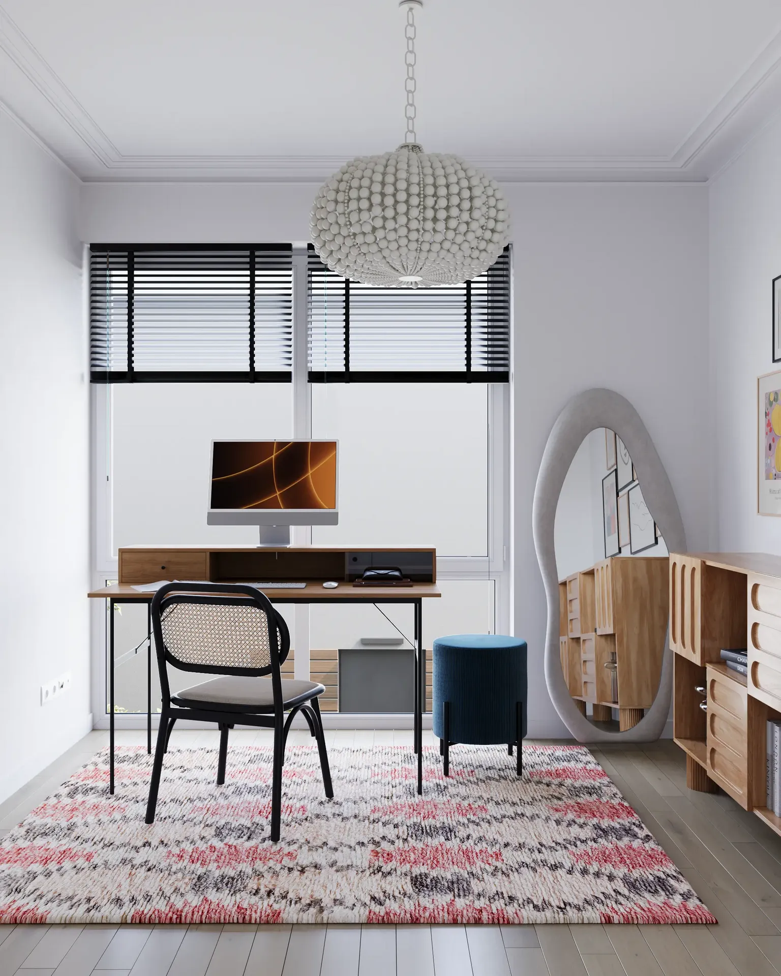 Workspace by the window with a desk, mirror, and chest of drawers.