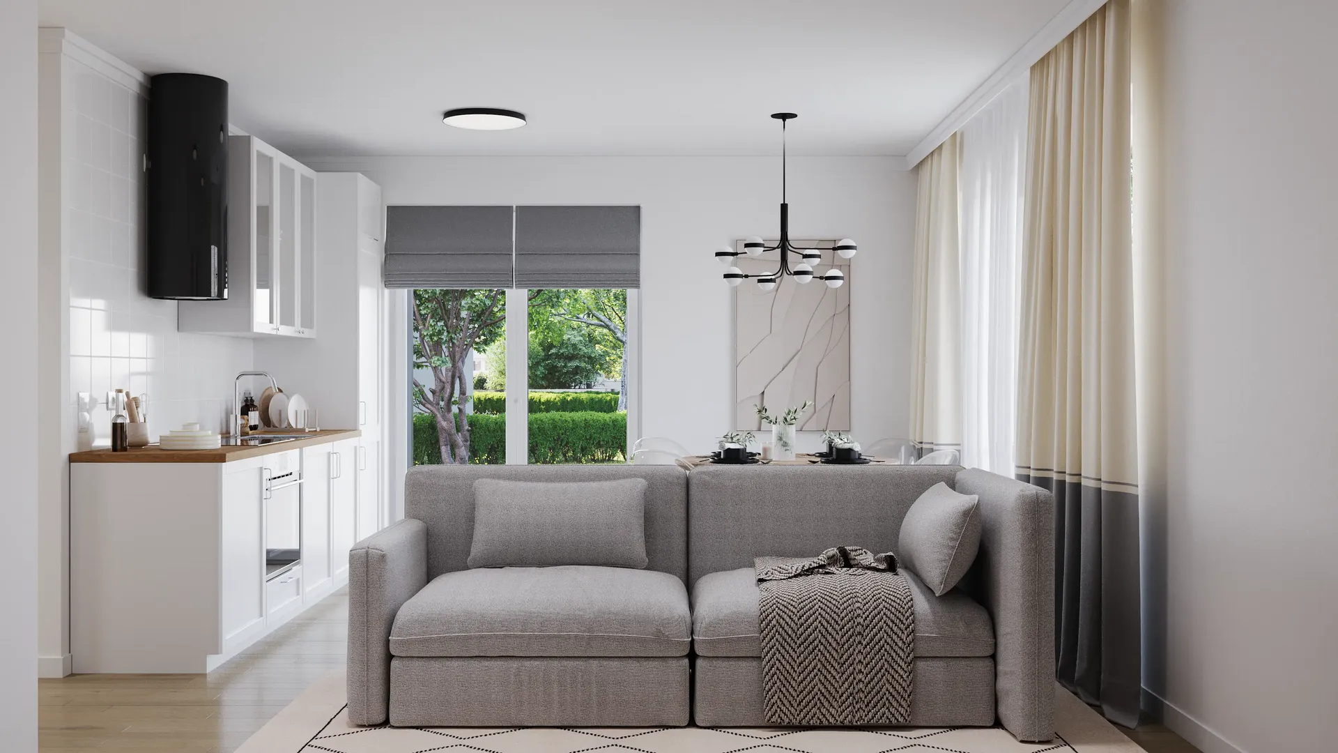 View of a kitchen and living room with sofa.