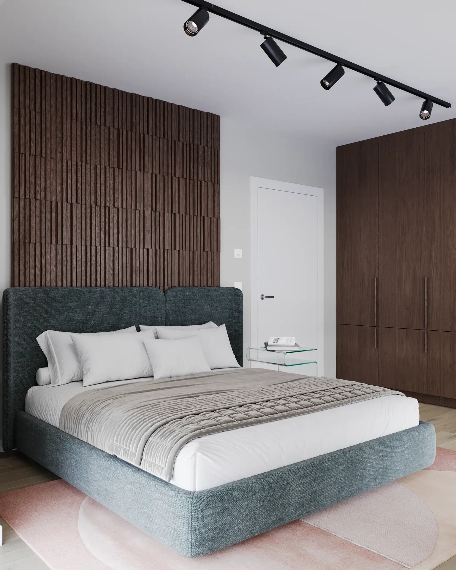 Angled view of a bed and wardrobe.