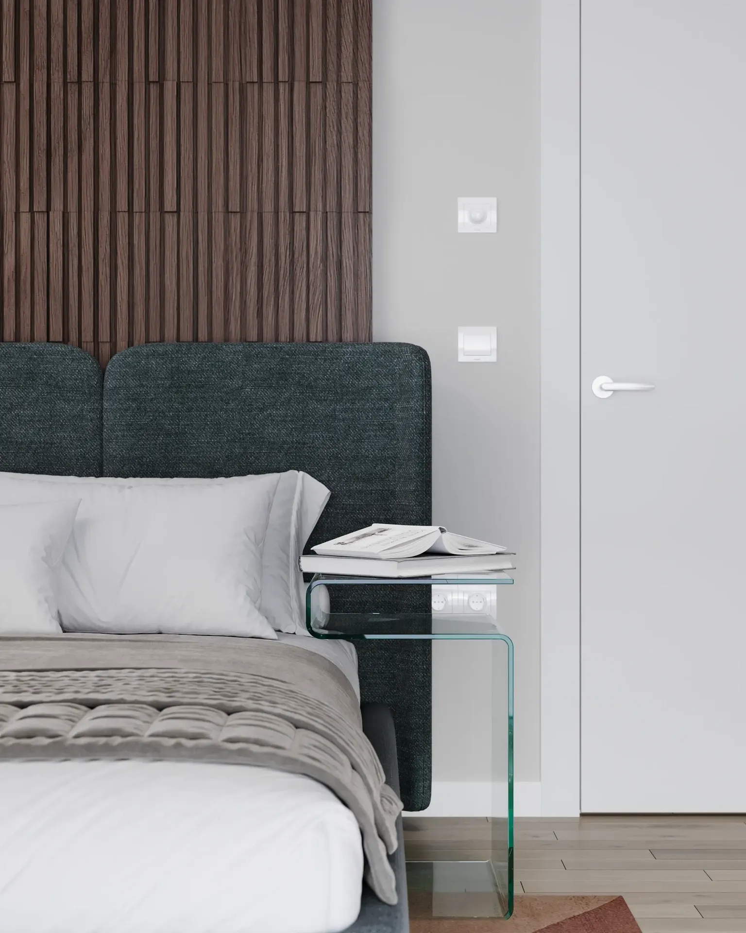 Bedside table with decor and headboard.