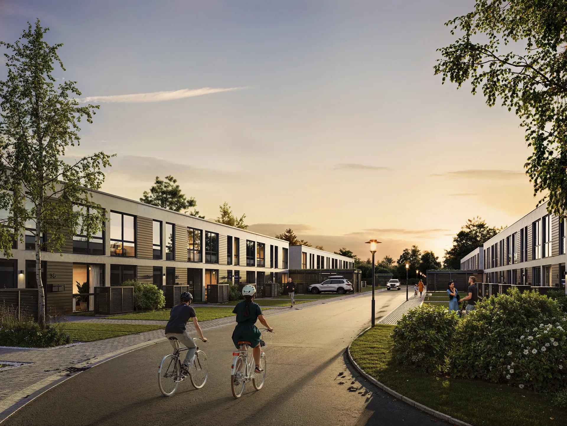 General evening street view with cyclists and pedestrians.