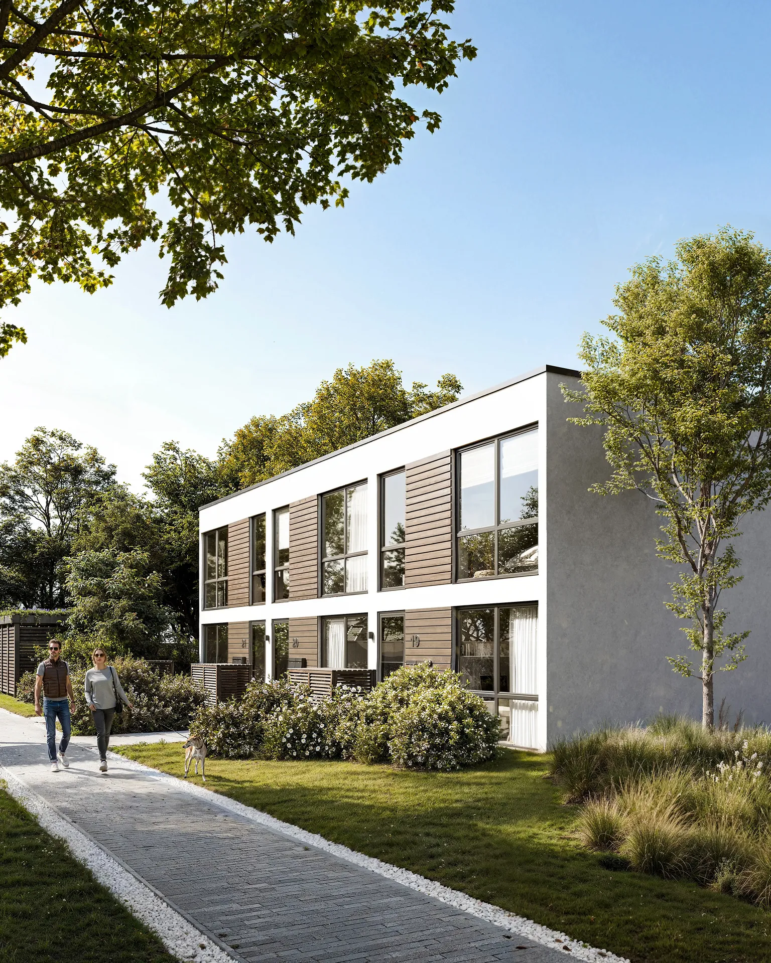 Angled view of a house with a couple walking on the path.