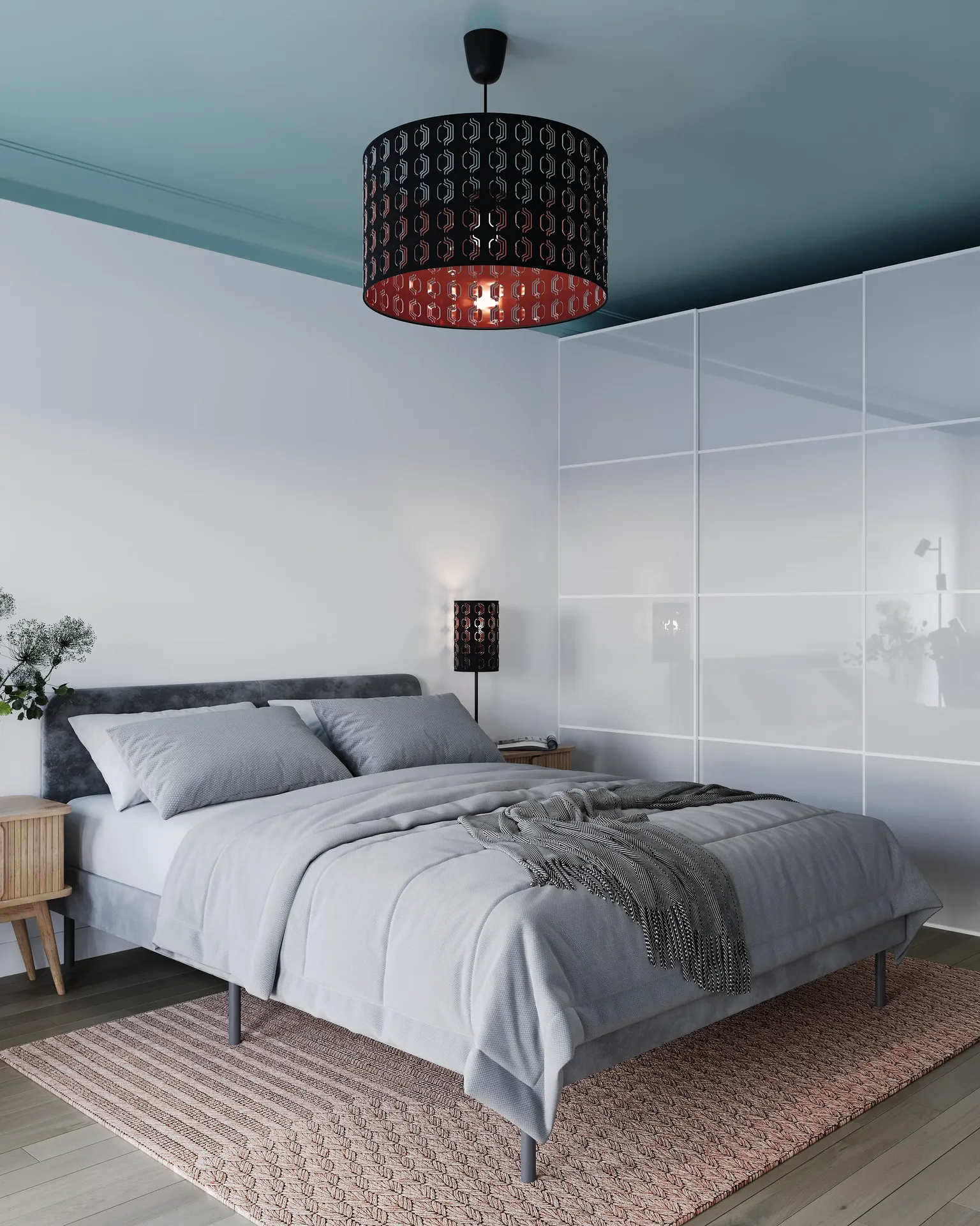 Angled view of a bed and wardrobe.