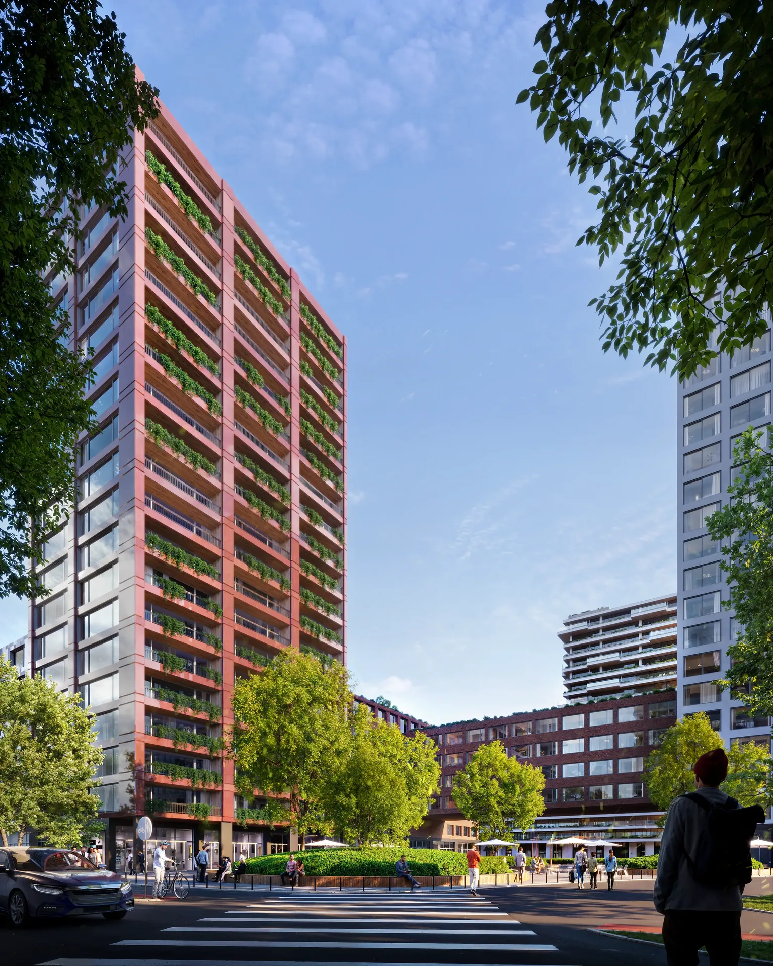 Street-level view of the modern residential complex from across a busy road with traffic and people.