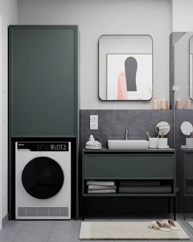 Front view of a sink vanity, mirror, and washing machine unit.