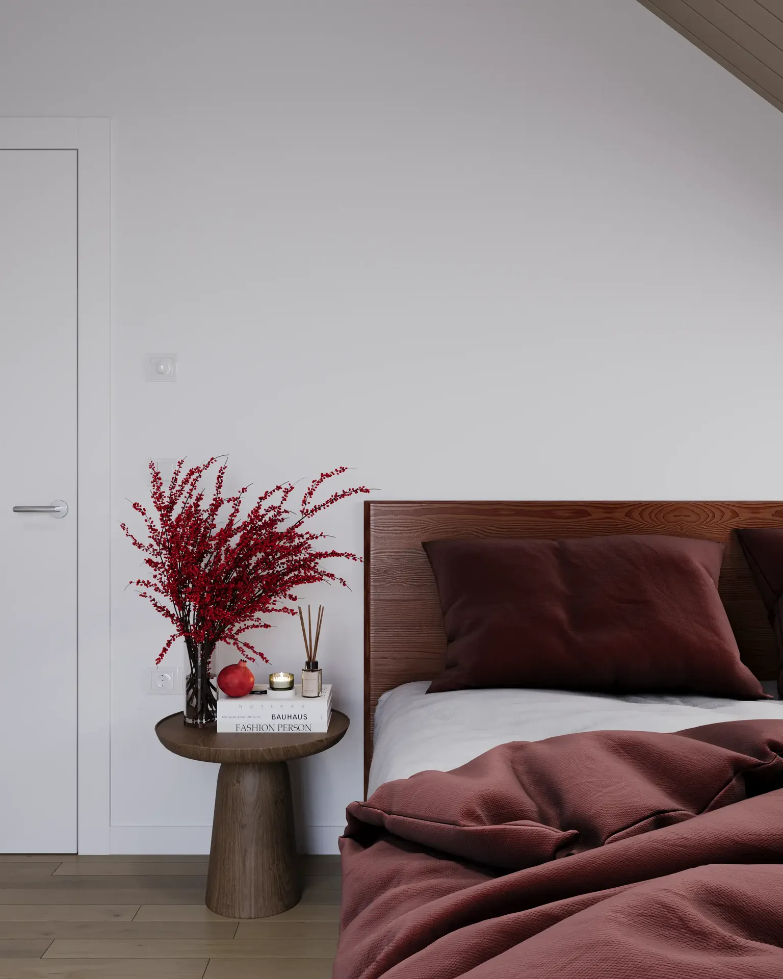 Bedside table with decor and headboard.