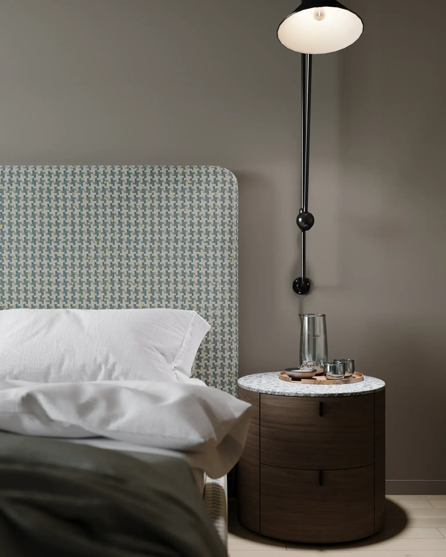 Close-up of a wall sconce and bedside table.