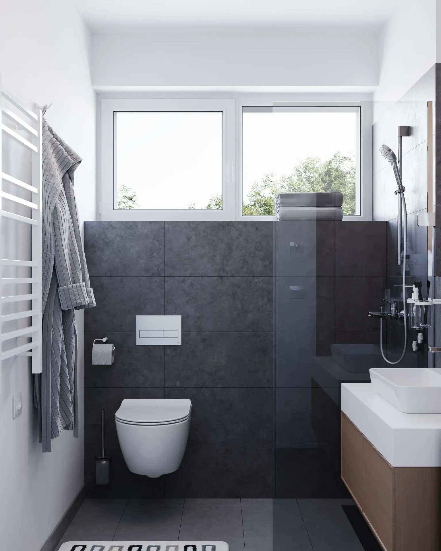Compact bathroom interior with dark tile wall and white fixtures.