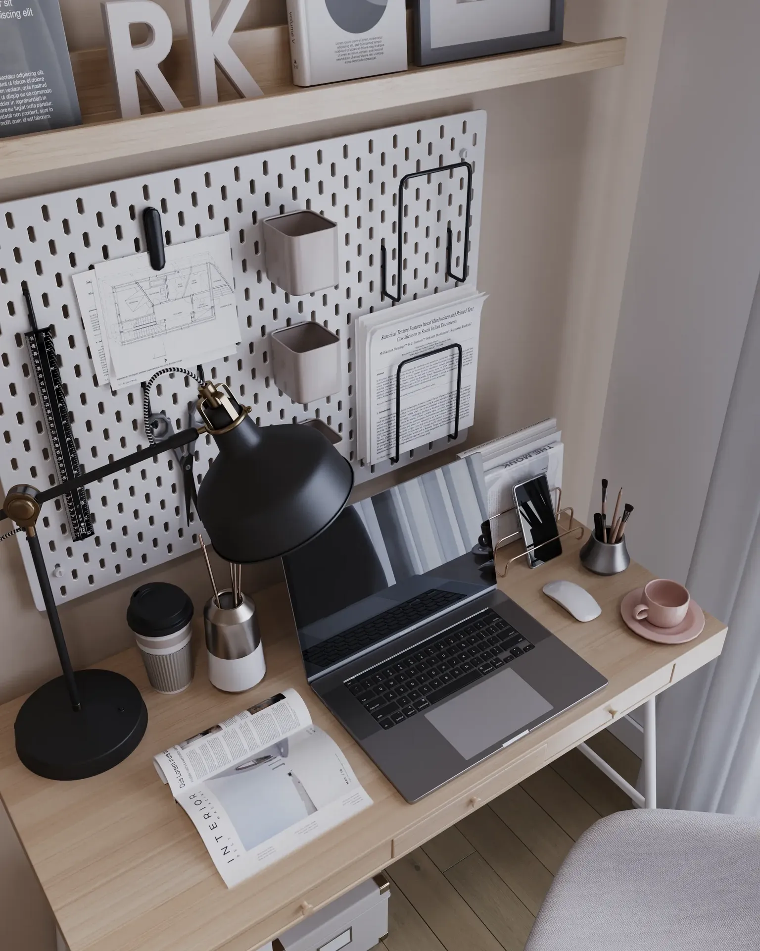Workspace decor with laptop, lamp, and stationery.