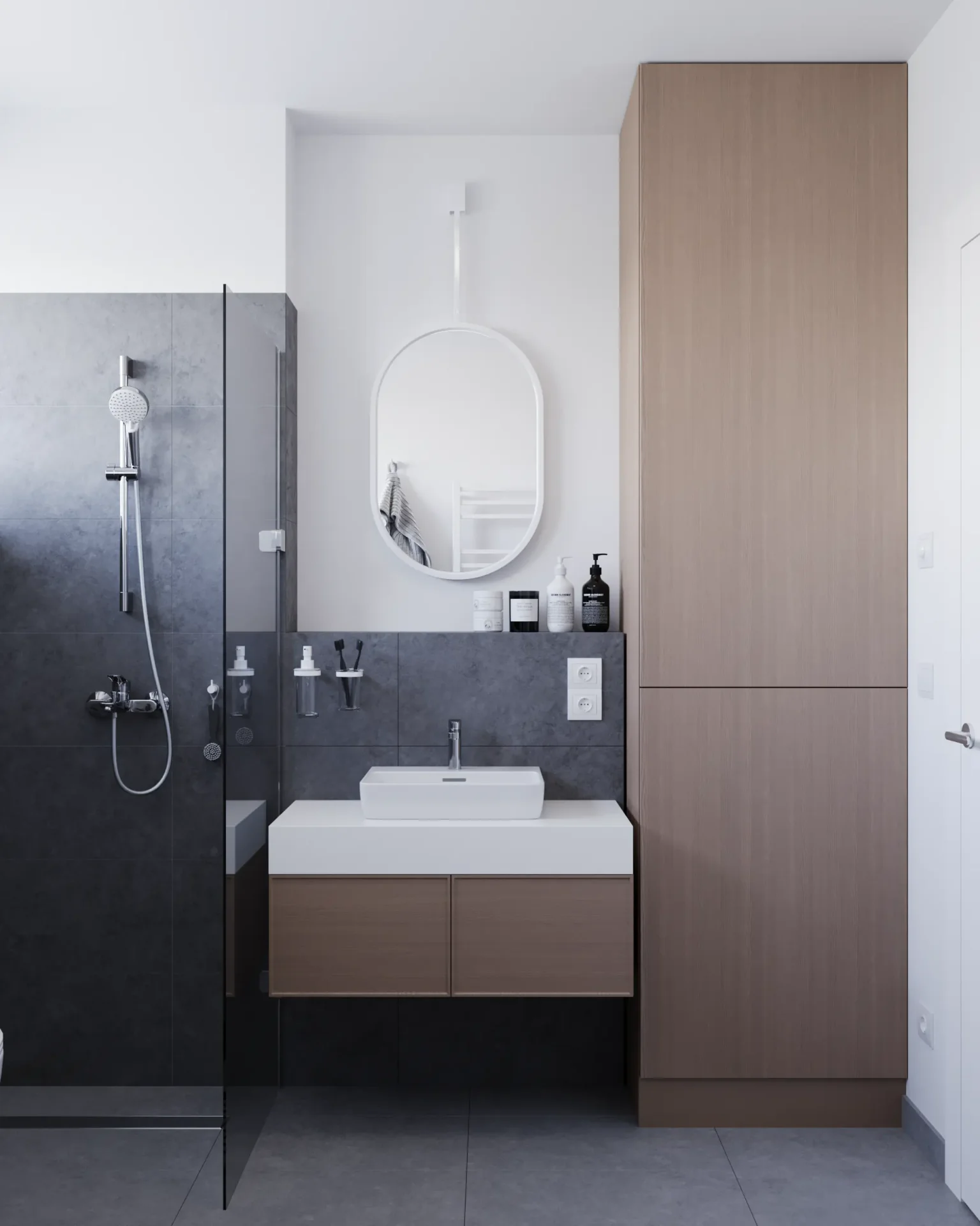 Minimalist bathroom with dark gray tiles and floating wooden vanity.
