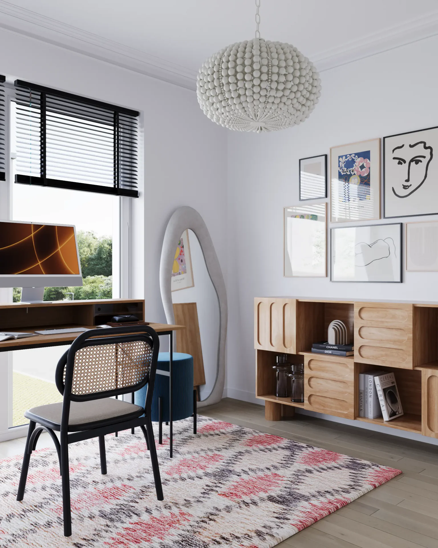 Angled view of a workspace by the window with a desk and mirror.