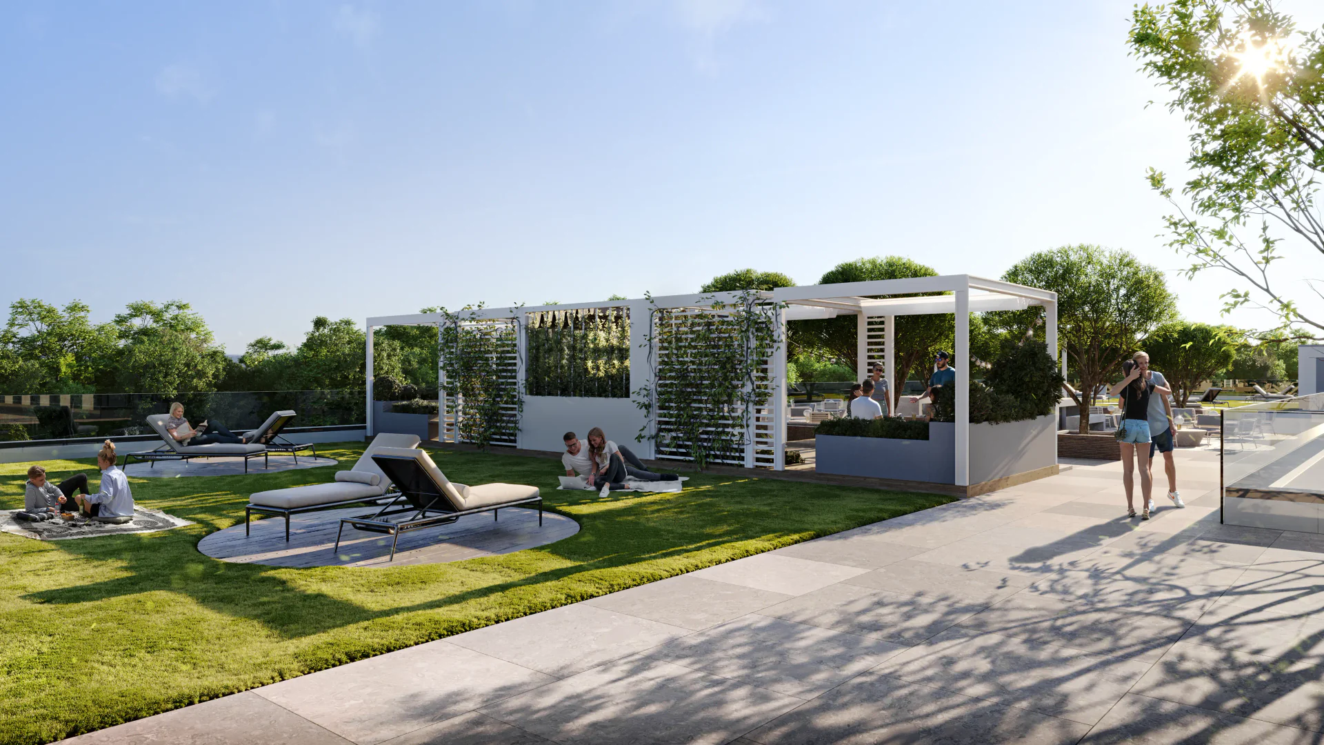 Sunlit relaxation area in a complex, featuring modern sun loungers, gazebos, and landscaped pathways.