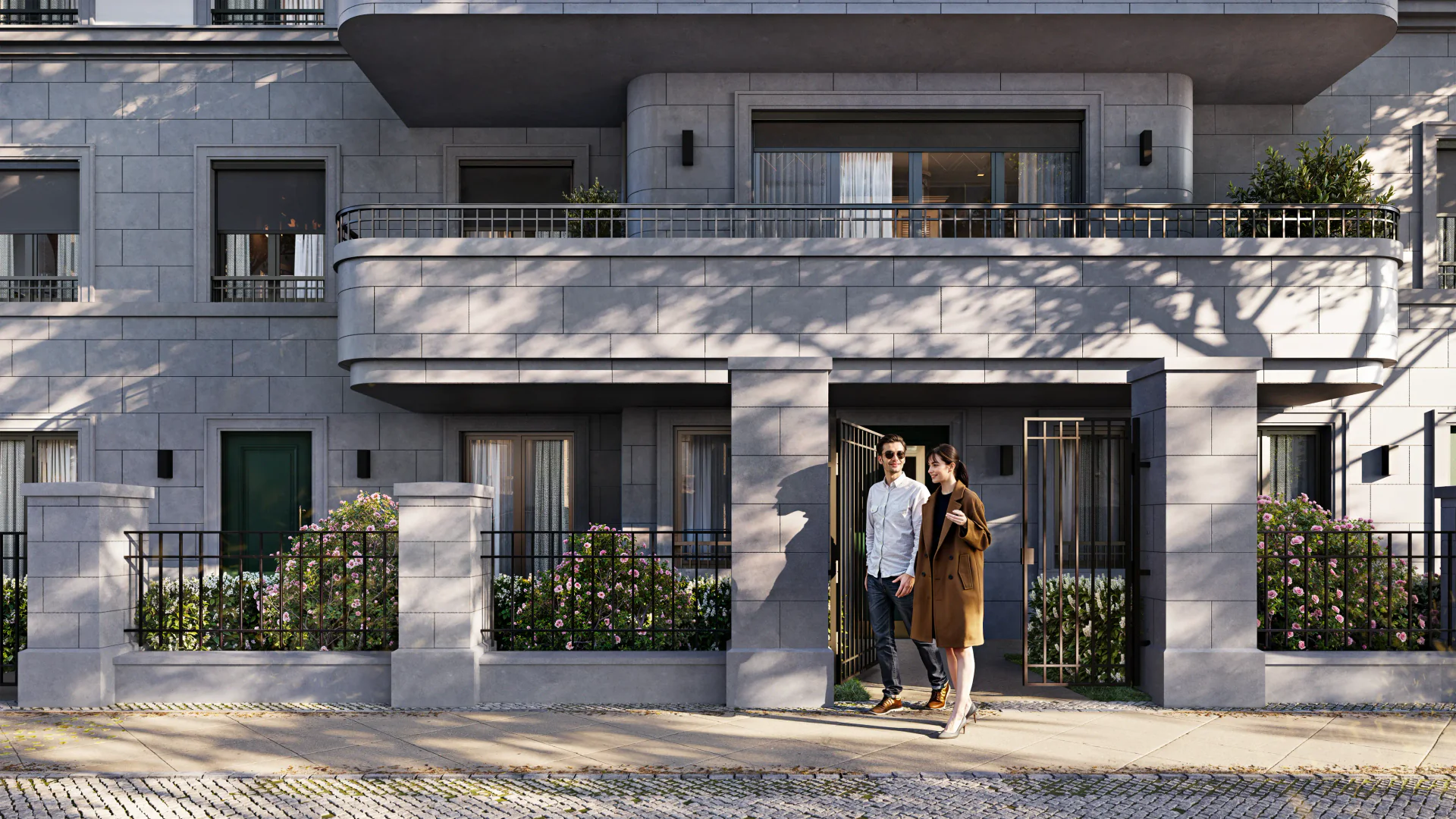Modern residential building entrance, showing a couple exiting onto the landscaped street.