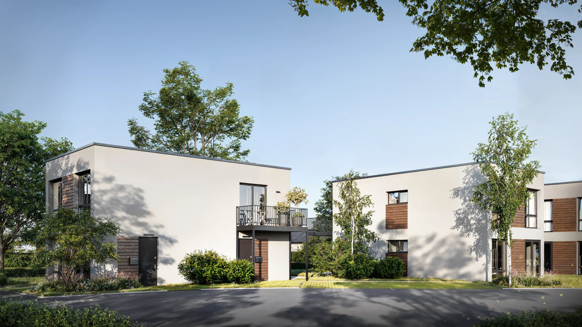 Angled view of the front facade and entrance of a modern residence.
