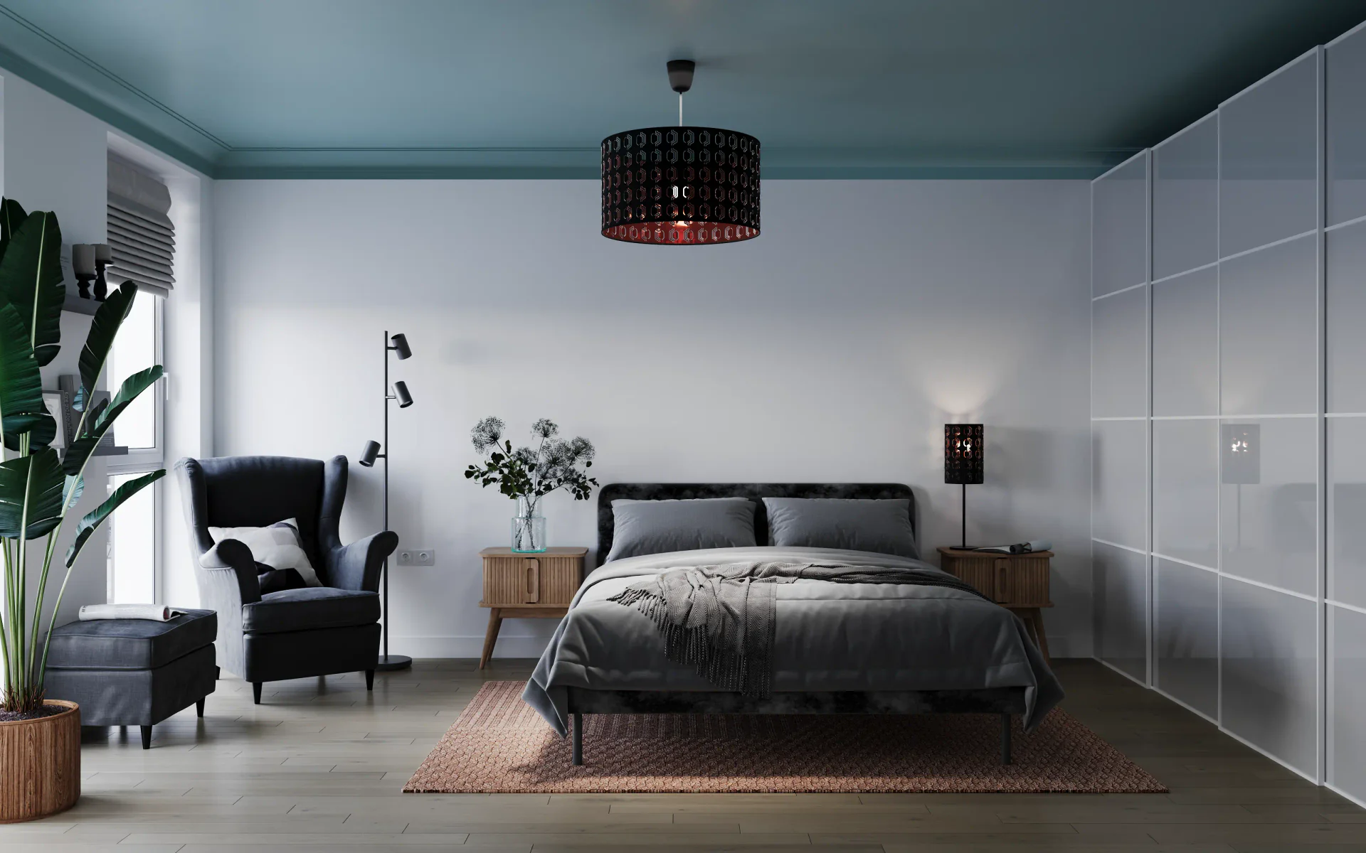 Front view of a bed, armchair, lamp, and wardrobe.