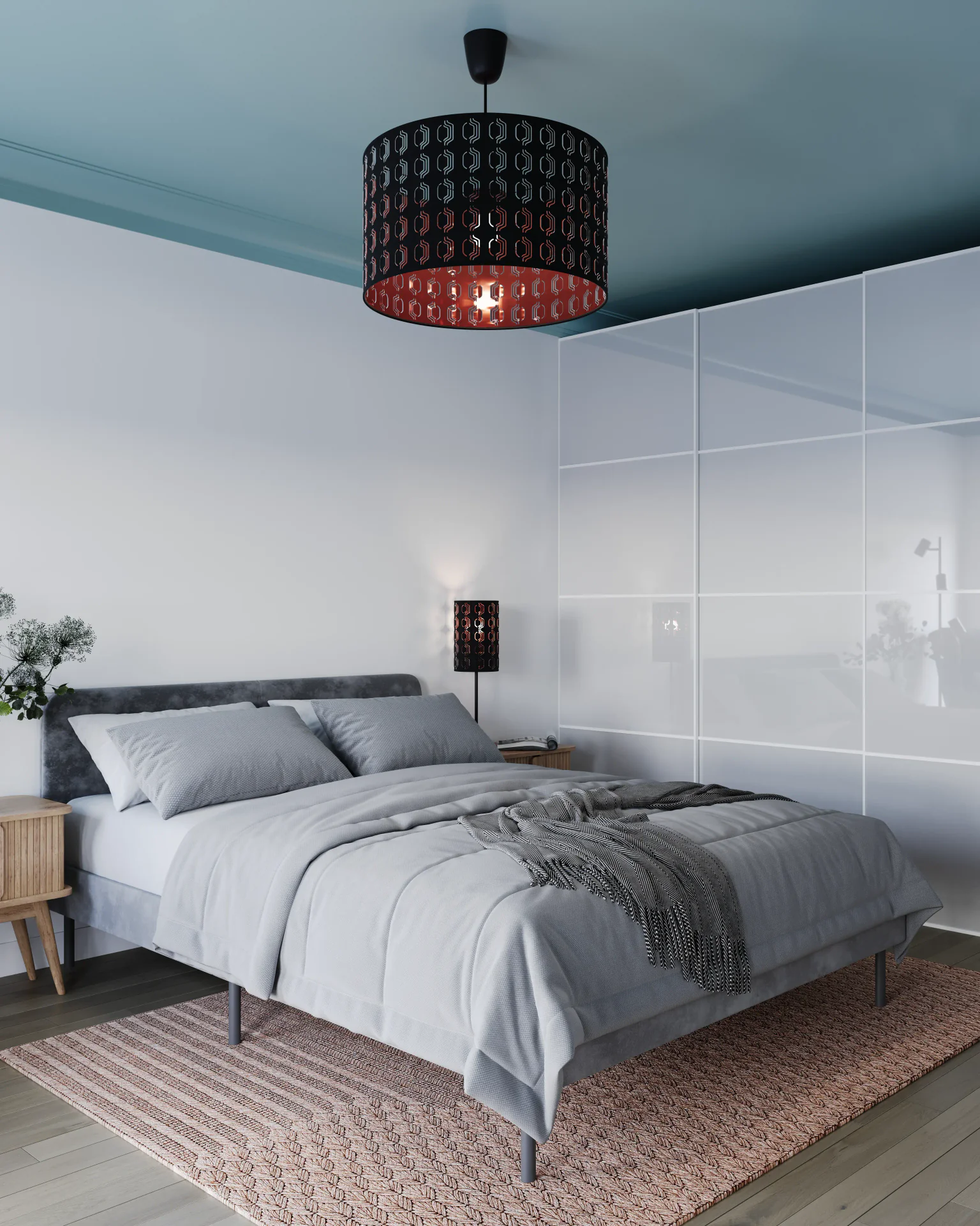 Angled view of a bed and wardrobe.