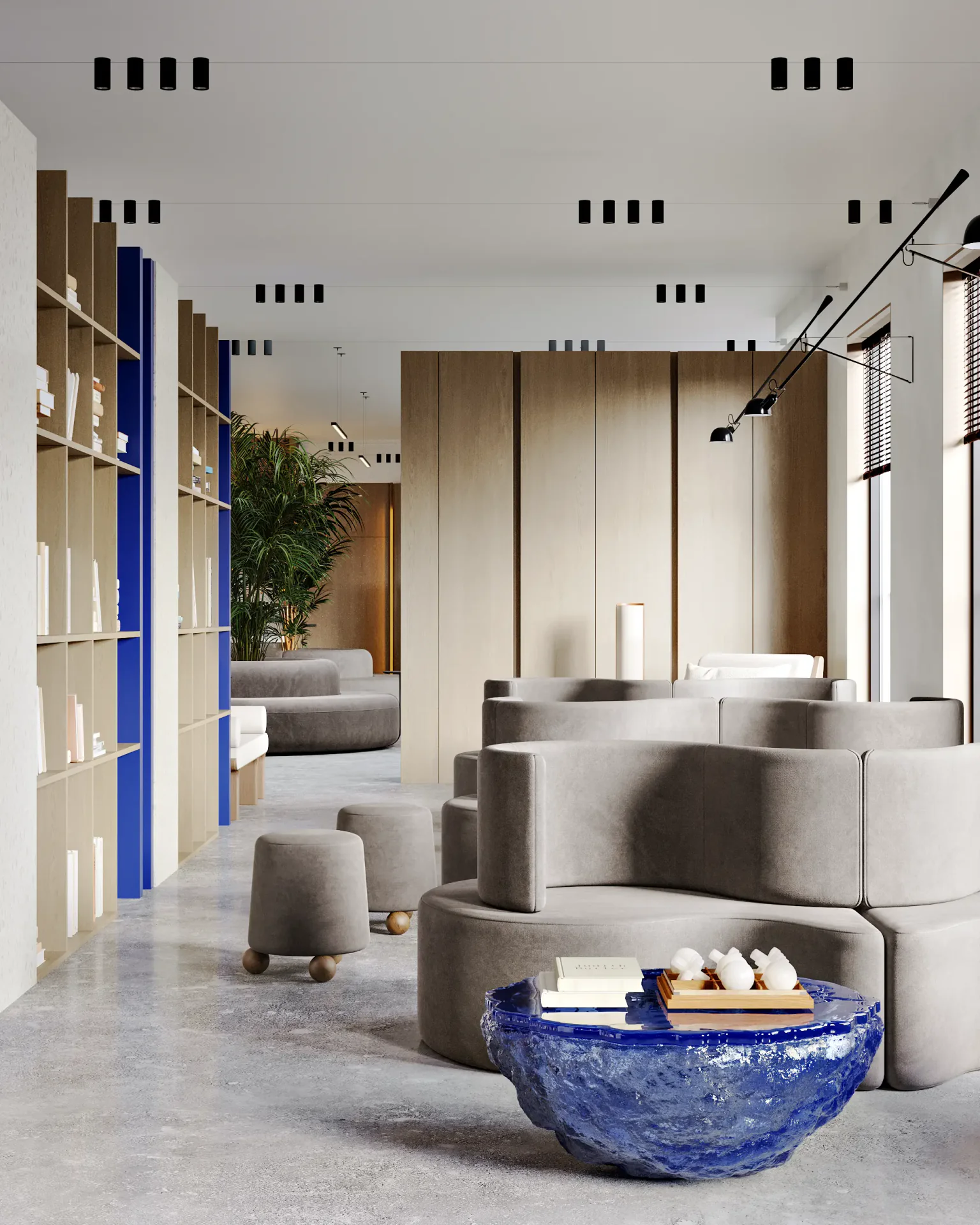 Library study area featuring high-back sofas that create semi-private nooks for focused work.