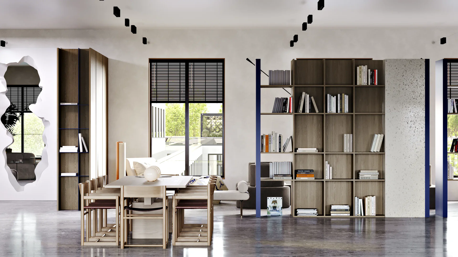 Bright common area featuring a large meeting table and custom shelving by the window.