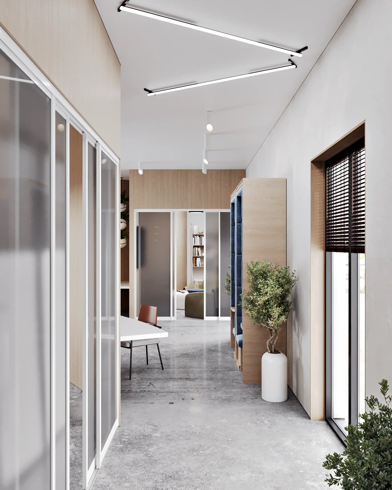 Modern office hallway with entrances to a glass-walled meeting room and a lounge area.