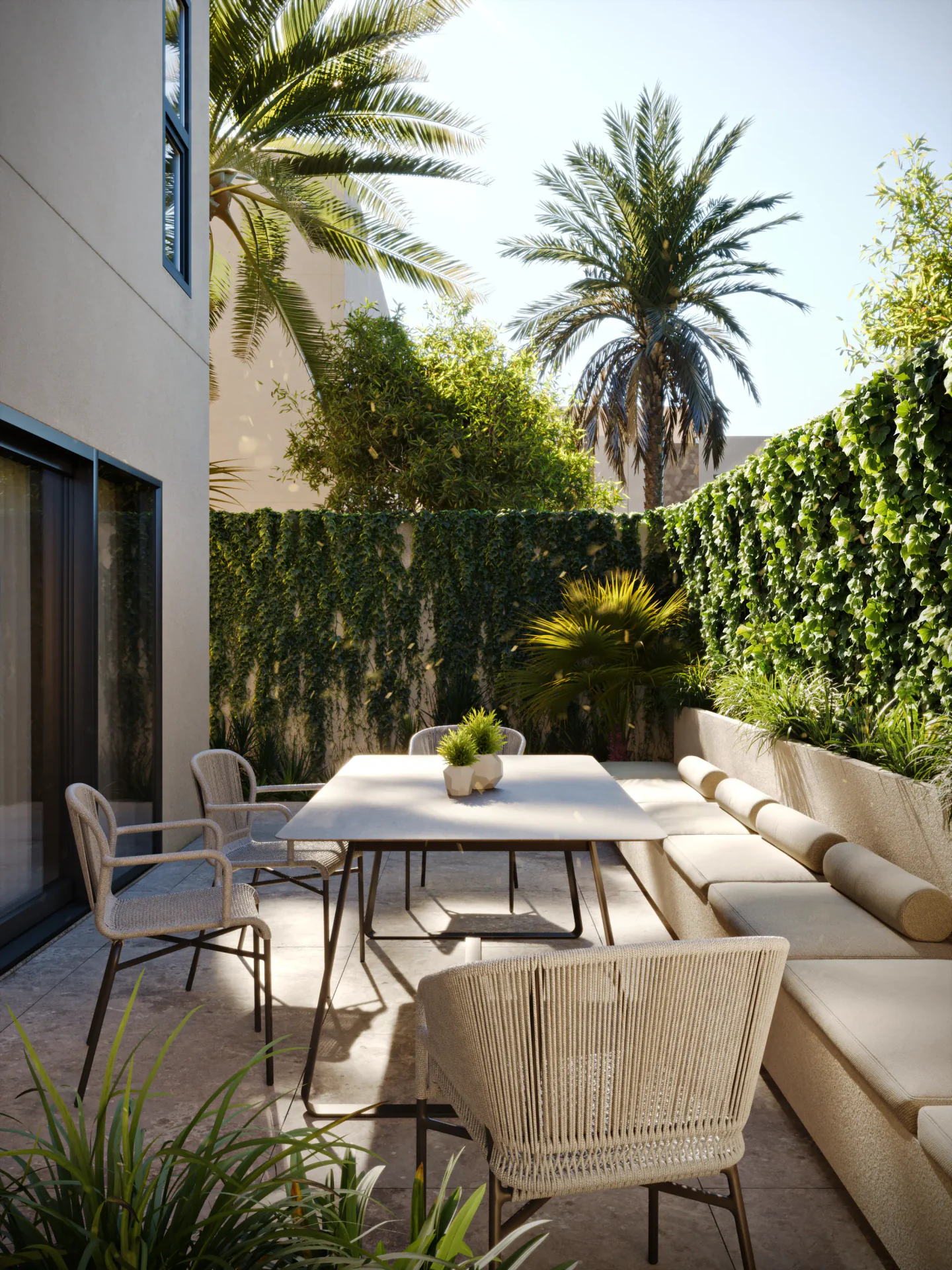 Outdoor terrace seating area with furniture and privacy hedge landscaping