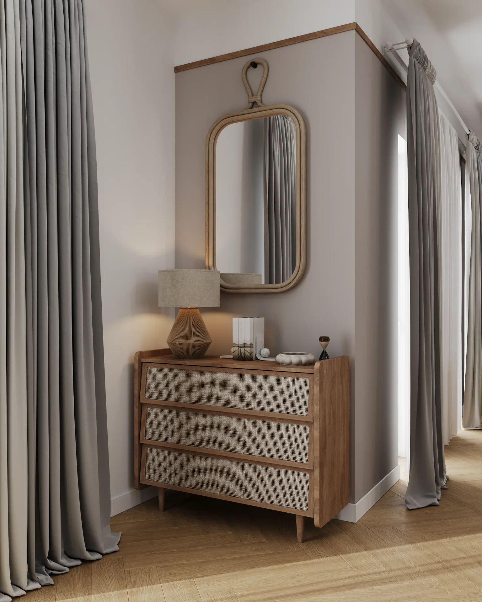 View of a chest of drawers with a mirror near the kitchen entrance.